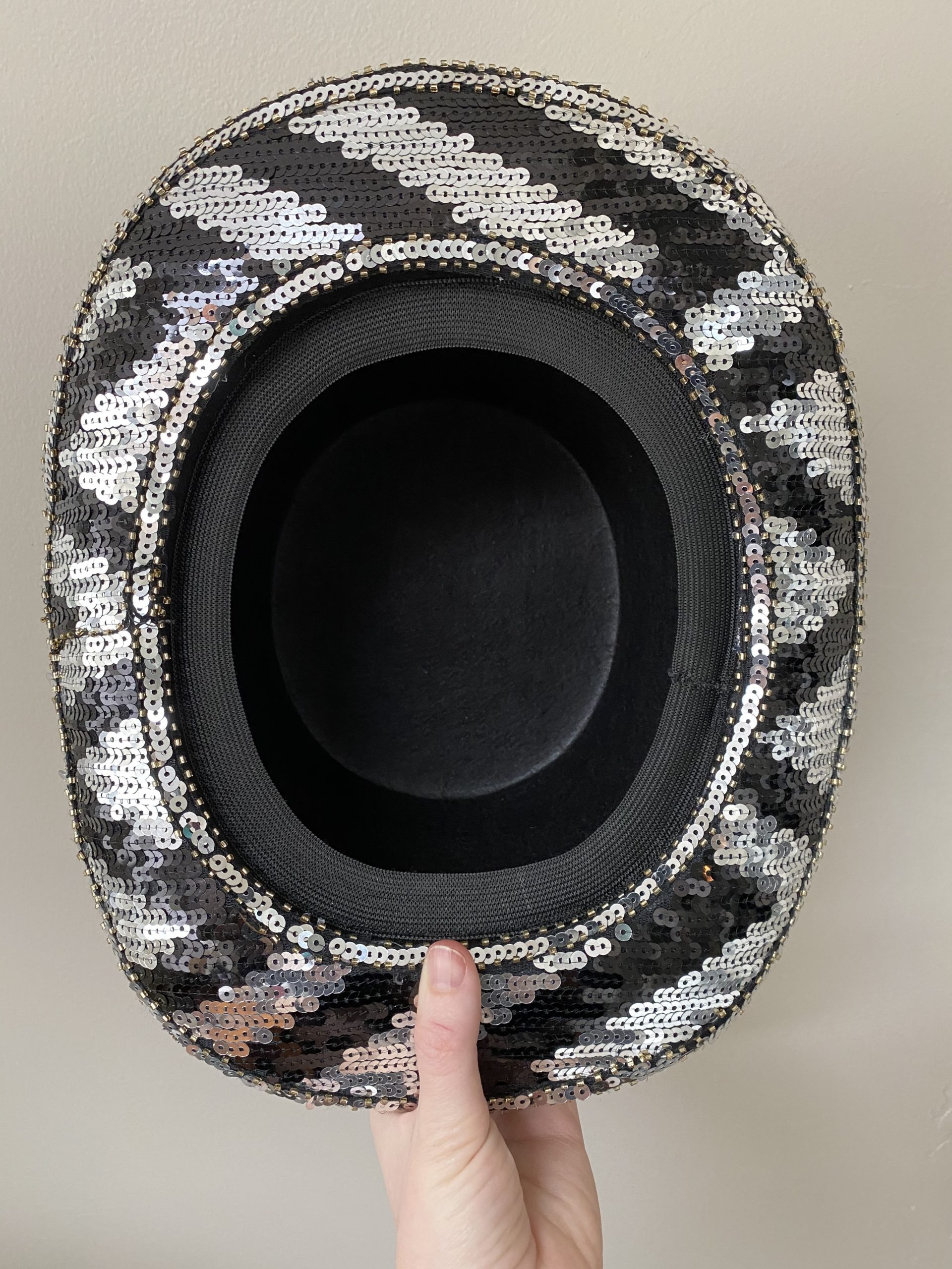 Black and white sequined top hat with googles
