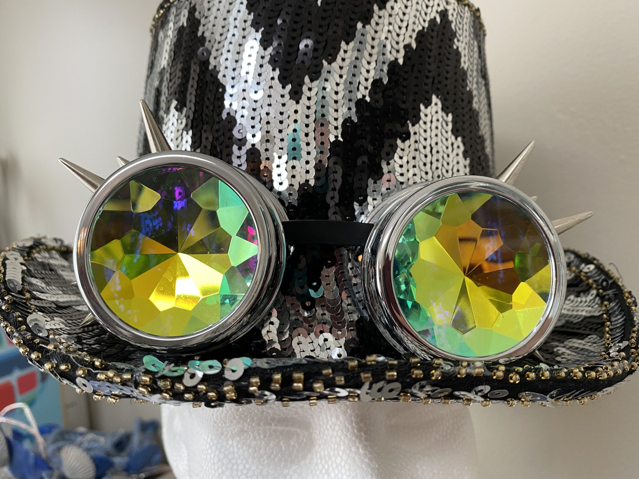 Black and white sequined top hat with googles