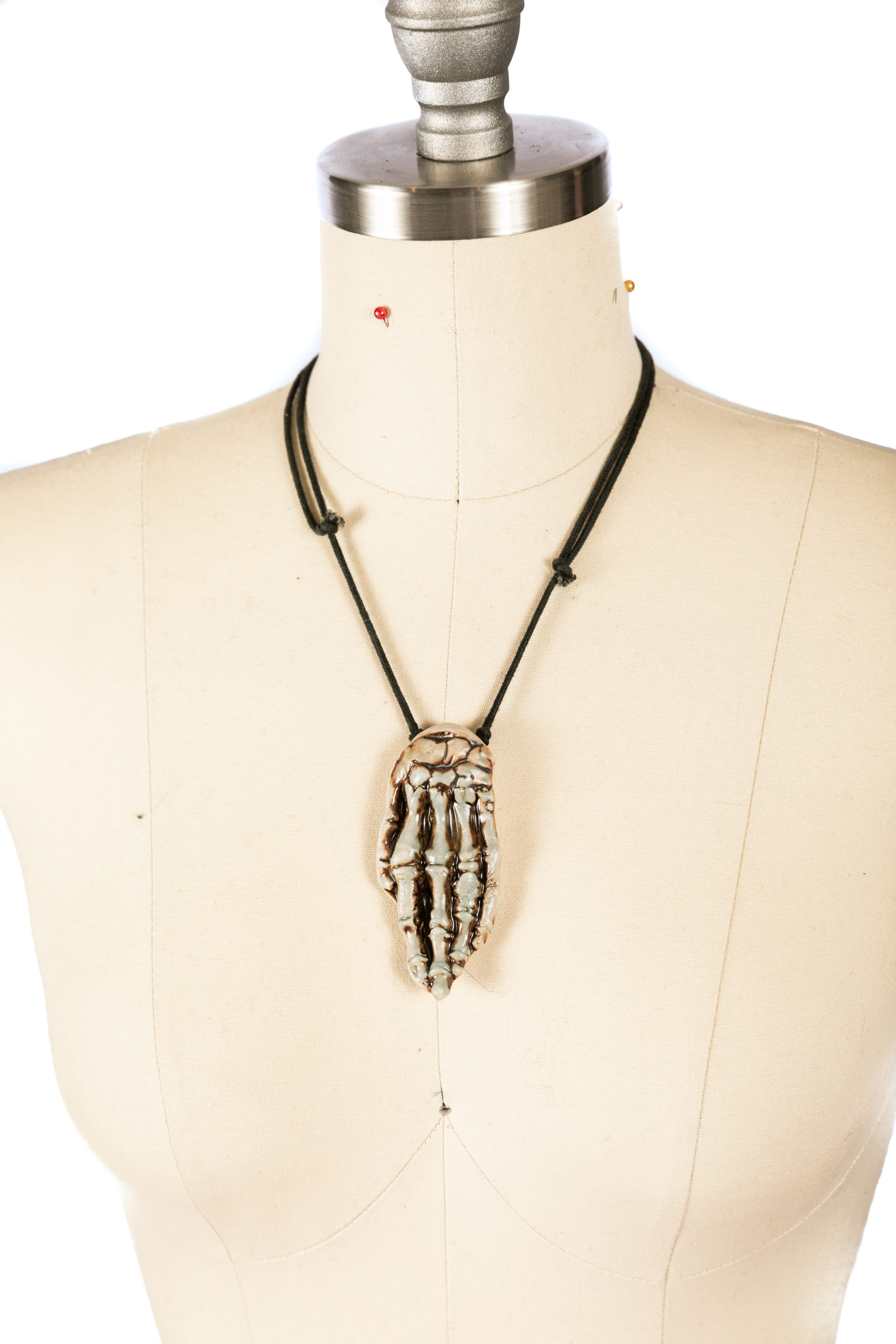 ceramic skeleton hand necklace